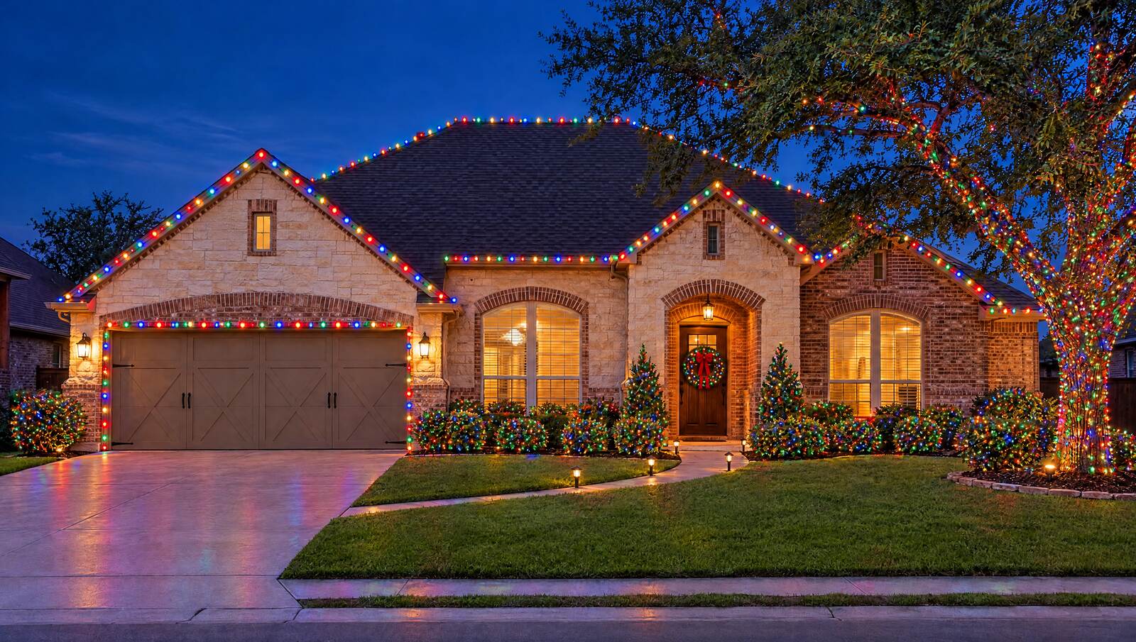The same home lit with Christmas lights